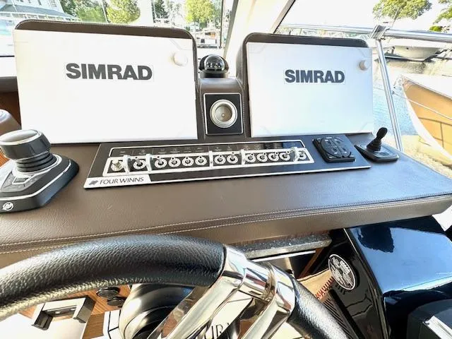 Three Beaches Yacht Photos Pics 2020 Four Winns Vista 355 Coupe OB helm with Simrad displays and controls.