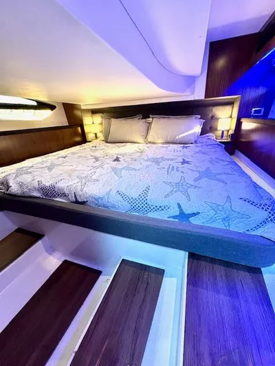 Three Beaches Yacht Photos Pics Luxurious cabin interior of 2020 Four Winns Vista 355 Coupe OB with starfish bedding.