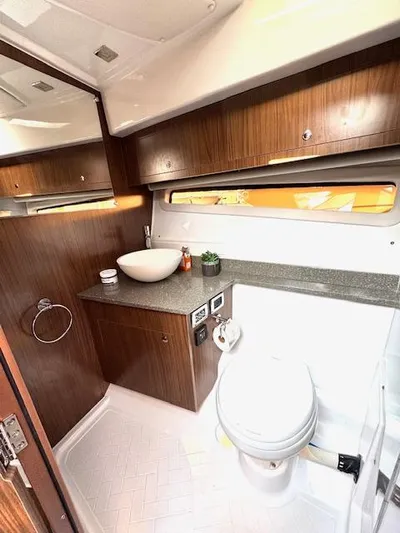 Three Beaches Yacht Photos Pics Luxurious bathroom interior of 2020 Four Winns Vista 355 Coupe OB yacht.