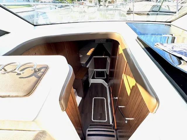 Three Beaches Yacht Photos Pics Interior of 2020 Four Winns Vista 355 Coupe OB, featuring sleek wood finishes and modern design.