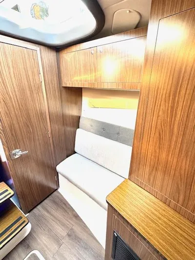 Three Beaches Yacht Photos Pics 2020 Four Winns Vista 355 Coupe OB interior with wood paneling and seating.