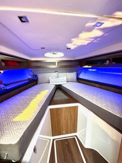 Three Beaches Yacht Photos Pics Interior cabin of 2020 Four Winns Vista 355 Coupe OB with blue ambient lighting.