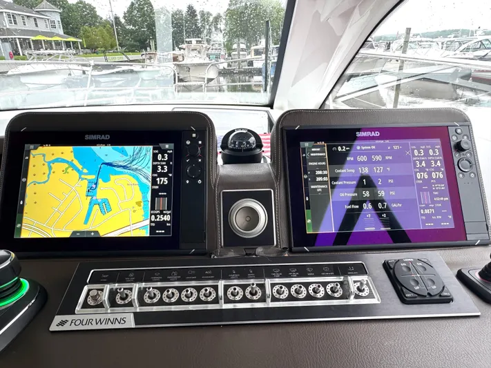 Three Beaches Yacht Photos Pics 2020 Four Winns Vista 355 Coupe OB dashboard with dual Simrad displays and control panel.