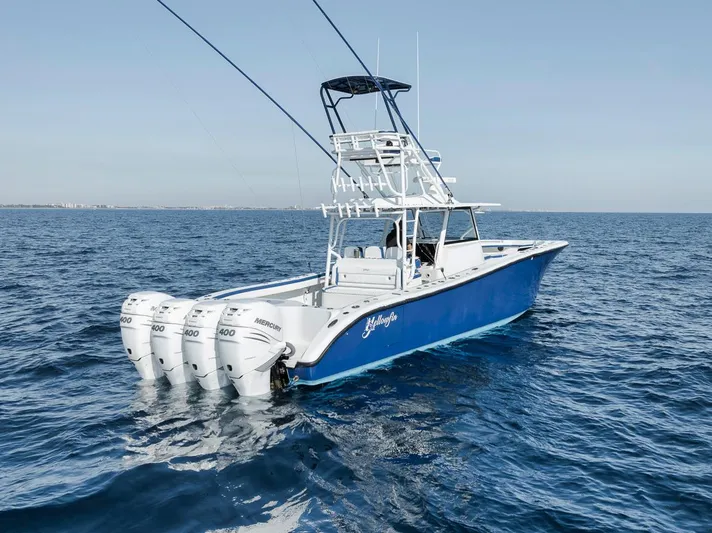  Yacht Photos Pics 2020 Yellowfin 42 Offshore boat with quad Mercury engines on open sea.