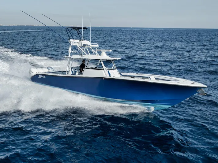 Yacht Photos Pics 2020 Yellowfin 42 Offshore boat cruising on open ocean waters.