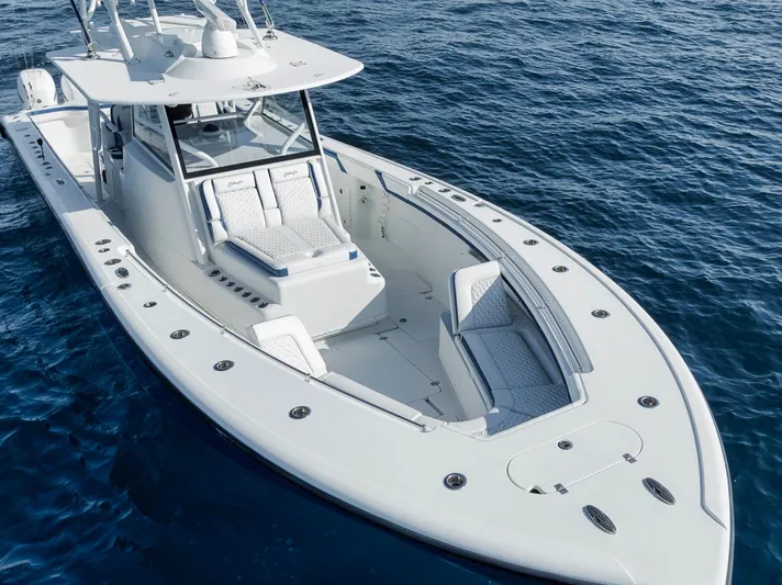  Yacht Photos Pics 2020 Yellowfin 42 Offshore boat on open water, showcasing sleek design and spacious deck.