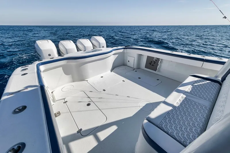  Yacht Photos Pics 2020 Yellowfin 42 Offshore boat with spacious deck and four engines on open sea.