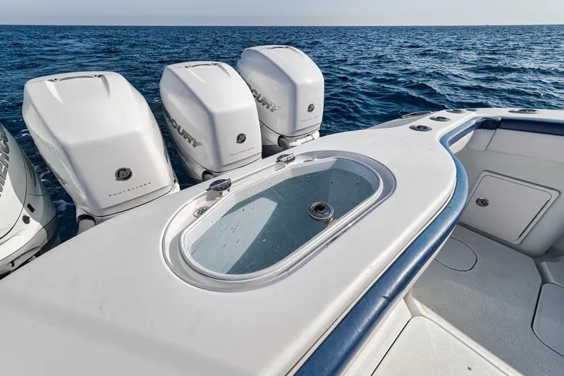  Yacht Photos Pics 2020 Yellowfin 42 Offshore boat with four powerful outboard engines on open sea.