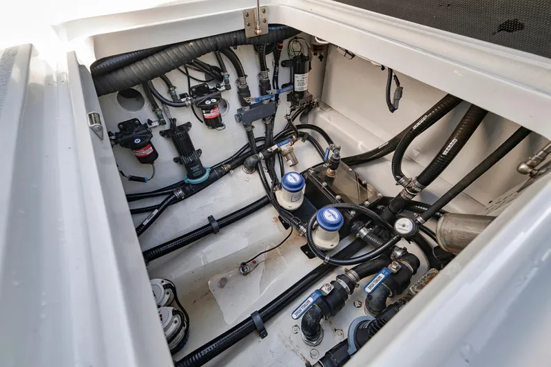  Yacht Photos Pics Engine compartment of a 2020 Yellowfin 42 Offshore boat, showcasing detailed wiring and components.