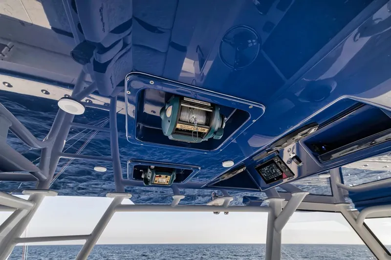  Yacht Photos Pics 2020 Yellowfin 42 Offshore boat interior with blue ceiling and equipment.