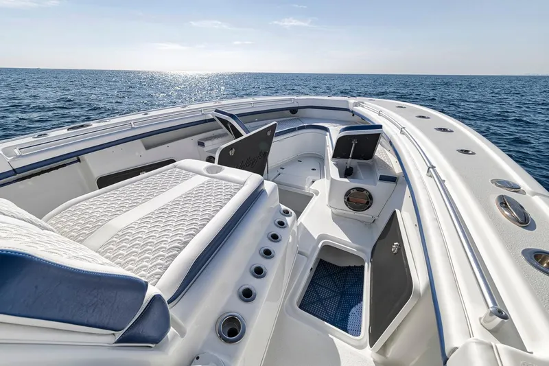 Yacht Photos Pics 2020 Yellowfin 42 Offshore boat interior with ocean view, featuring seating and storage compartments.