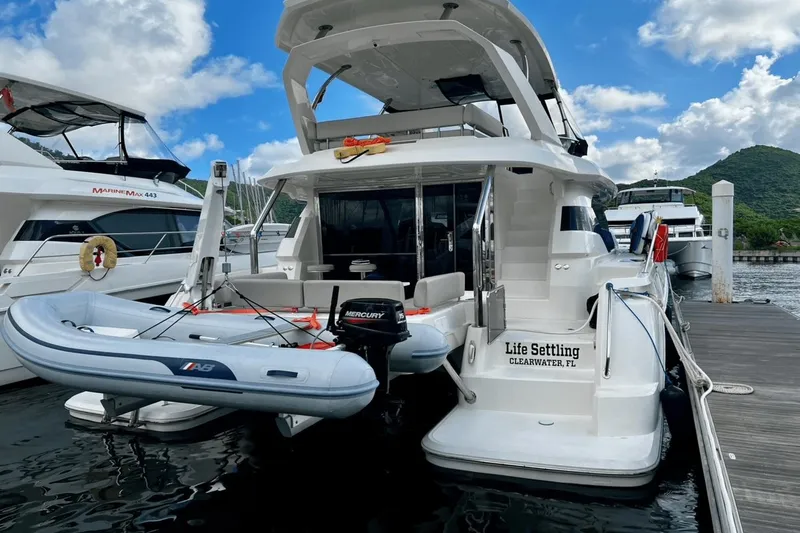 Life Settling Yacht Photos Pics Aquila 44 yacht docked with inflatable boat, Clearwater, FL, 2022 model.