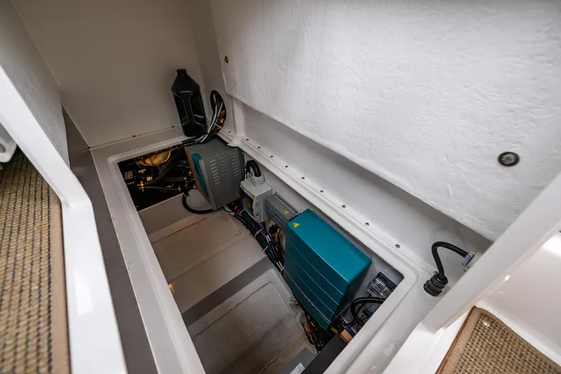 #41 Trade In Yacht Photos Pics Engine compartment of 2022 Nimbus C11 boat, showcasing electrical components and wiring.