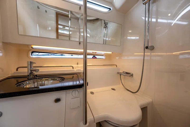 #41 Trade In Yacht Photos Pics Luxurious bathroom in 2022 Nimbus C11 yacht with modern fixtures and sleek design.