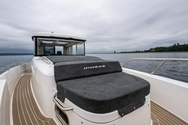 #41 Trade In Yacht Photos Pics Nimbus C11 2022 boat on calm water, featuring sleek design and spacious deck.