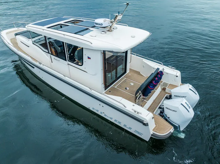 #41 Trade In Yacht Photos Pics 2022 Nimbus C11 boat with dual Mercury engines on calm water.