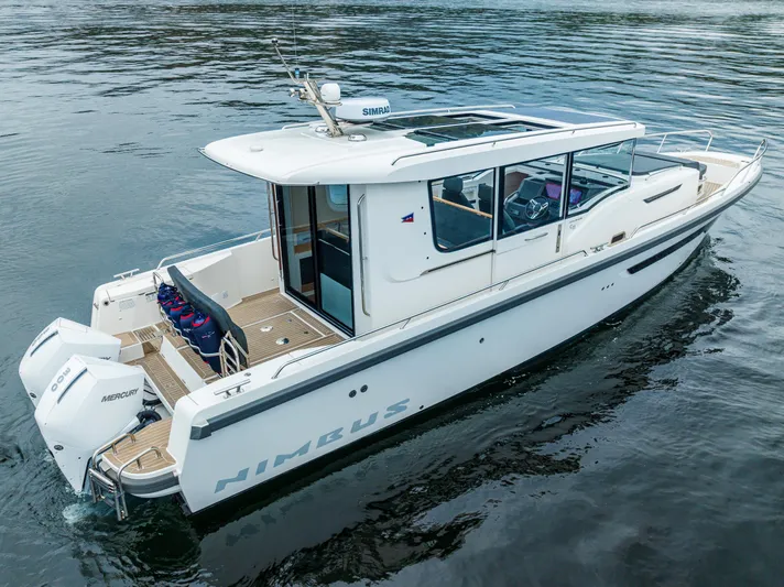 #41 Trade In Yacht Photos Pics Nimbus C11 2022 boat on water, featuring sleek design and twin engines.