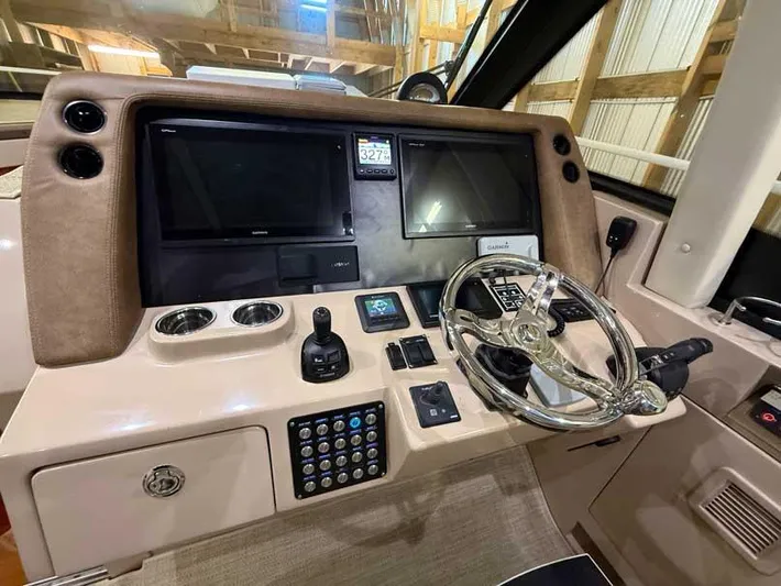  Yacht Photos Pics 2018 Intrepid 410 Evolution helm with dual screens, joystick, and modern controls.