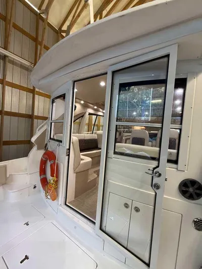  Yacht Photos Pics 2018 Intrepid 410 Evolution yacht interior with seating, life preserver, and modern design.