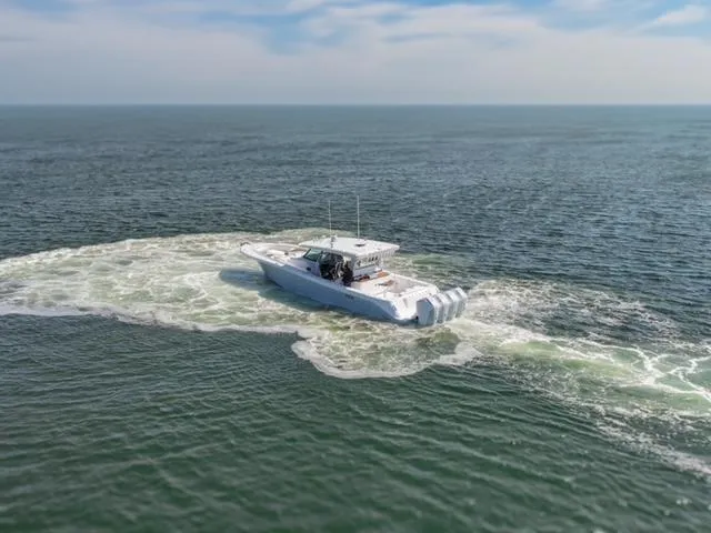  Yacht Photos Pics HCB 48 CAMPEON 2025 boat cruising on open water.