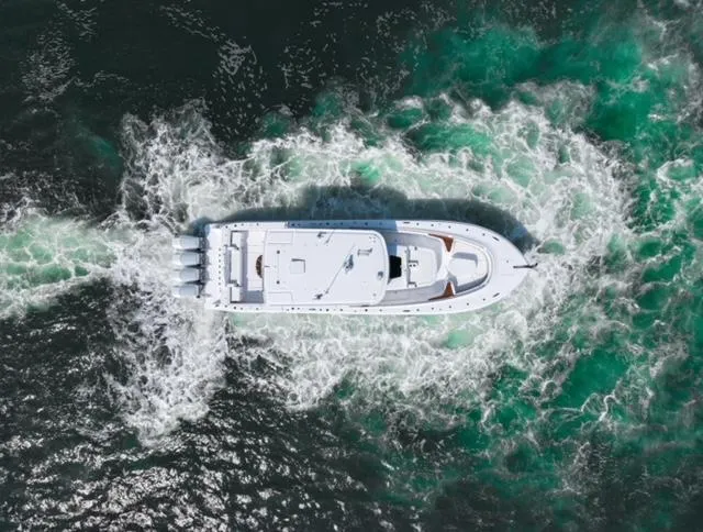  Yacht Photos Pics Aerial view of 2025 HCB 48 CAMPEON boat cruising through water.