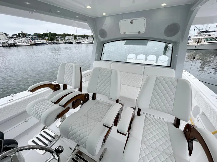  Yacht Photos Pics Luxurious 2025 HCB 48 Campeon boat interior with plush seating and elegant design.