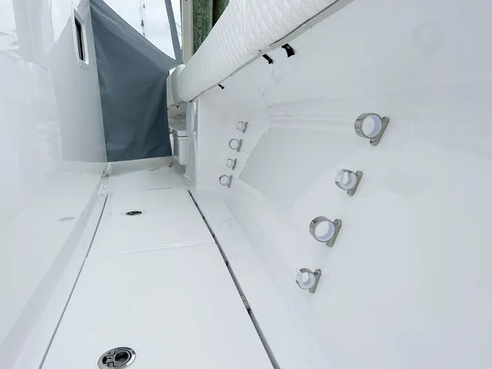  Yacht Photos Pics 2025 HCB 48 Campeon boat interior with rod holders and sleek white finish.