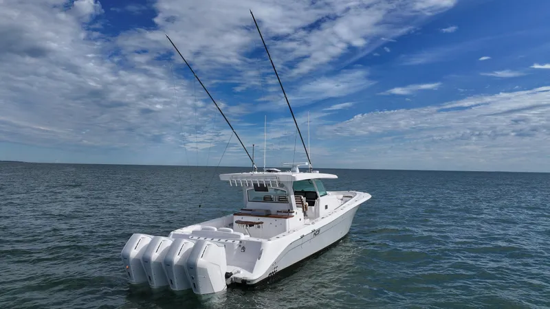  Yacht Photos Pics 2025 HCB 48 Campeon boat on open water under a blue sky.