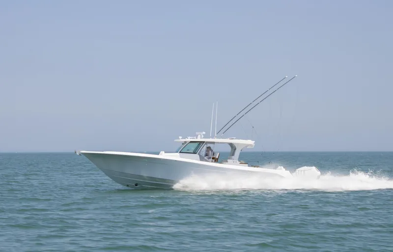  Yacht Photos Pics 2025 HCB 48 CAMPEON boat cruising on open water.