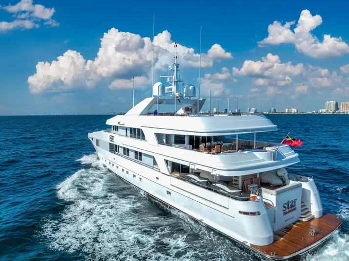 Star Diamond Yacht Photos Pics Luxurious 1998 Admiral Pilothouse yacht cruising on open sea under clear blue sky.
