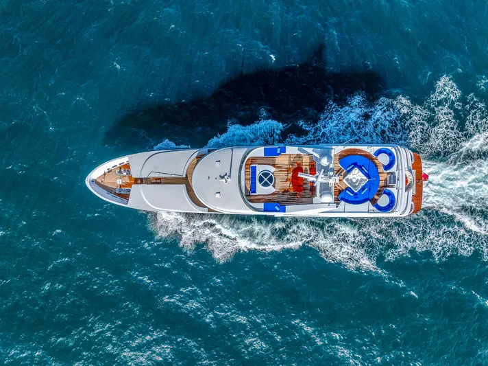 Star Diamond Yacht Photos Pics Aerial view of 1998 Admiral Pilothouse yacht cruising through blue ocean waters.