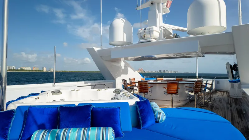 Star Diamond Yacht Photos Pics Luxurious 1998 Admiral Pilothouse yacht deck with jacuzzi and seating, ocean view.