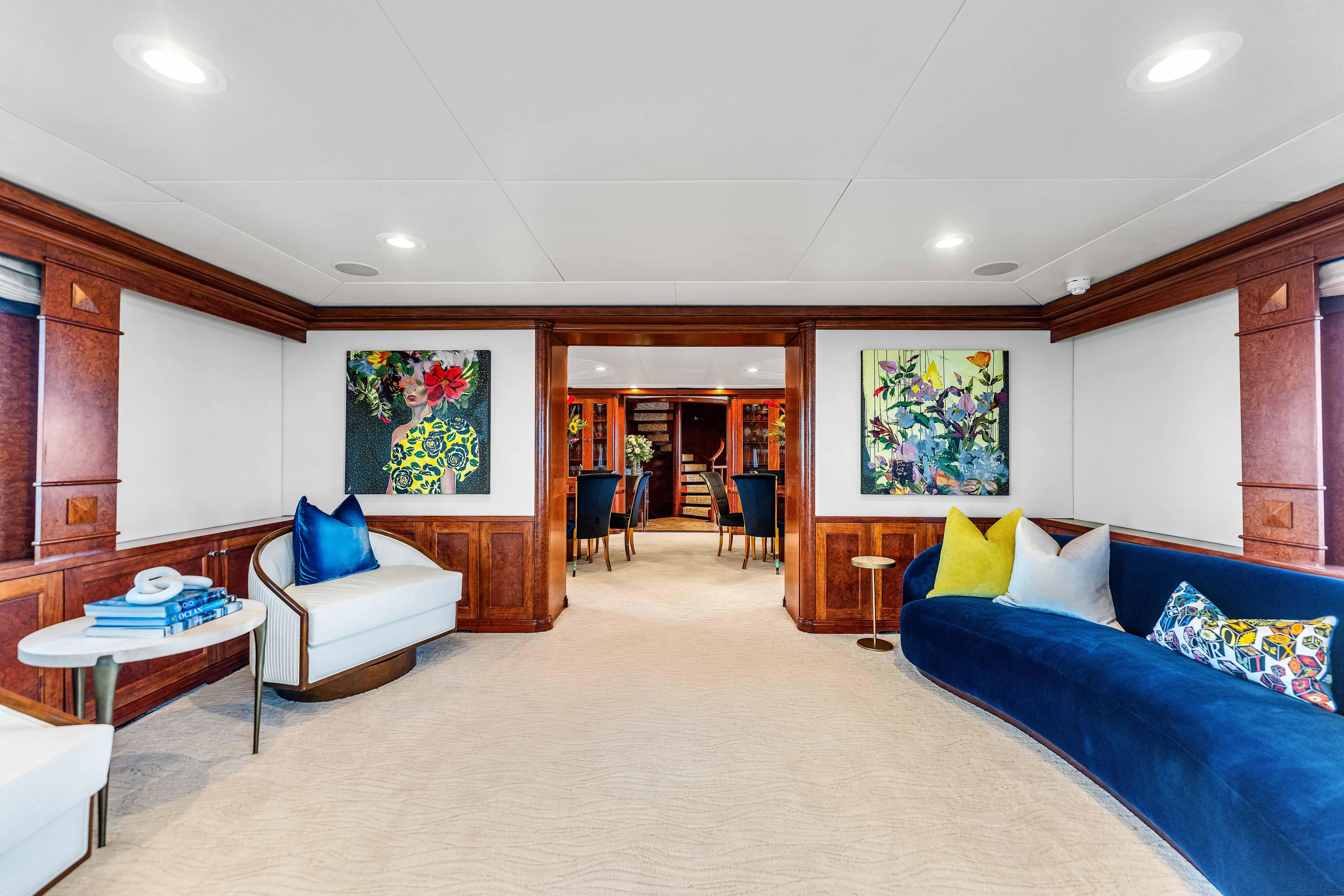 Star Diamond Yacht Photos Pics Luxurious 1998 Admiral Pilothouse yacht interior with elegant seating, vibrant artwork, and wooden accents.
