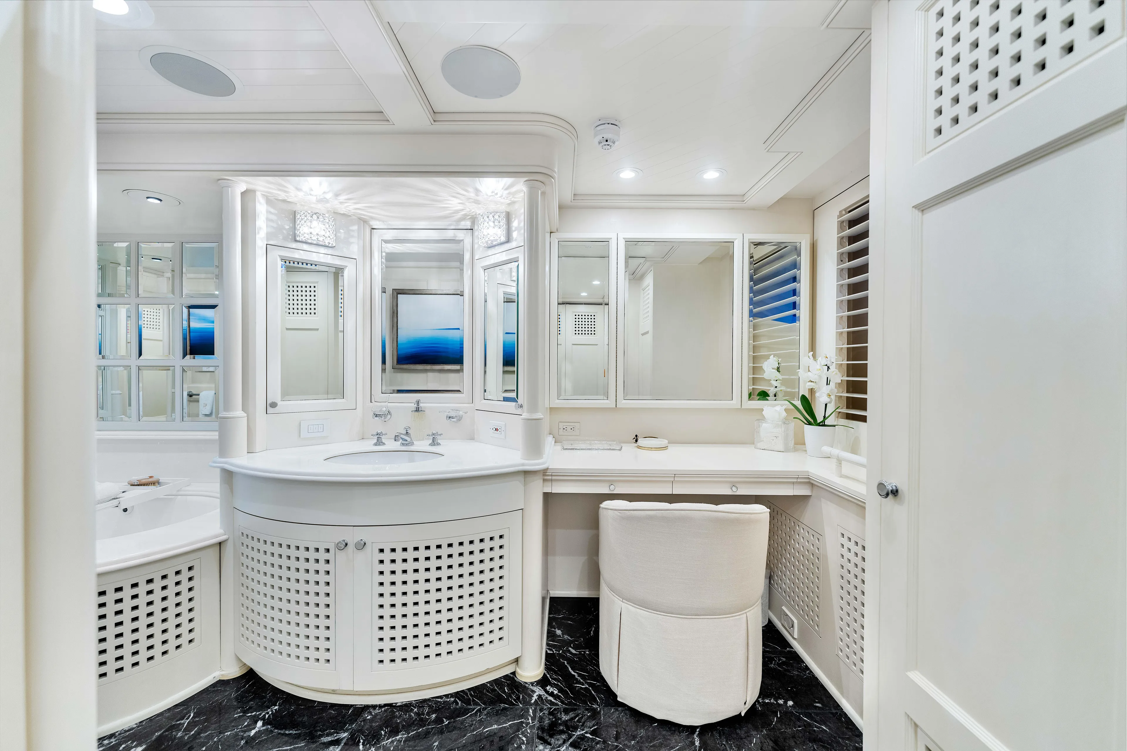 Star Diamond Yacht Photos Pics Luxurious white bathroom interior on a 1998 Admiral Pilothouse yacht, featuring elegant fixtures and decor.