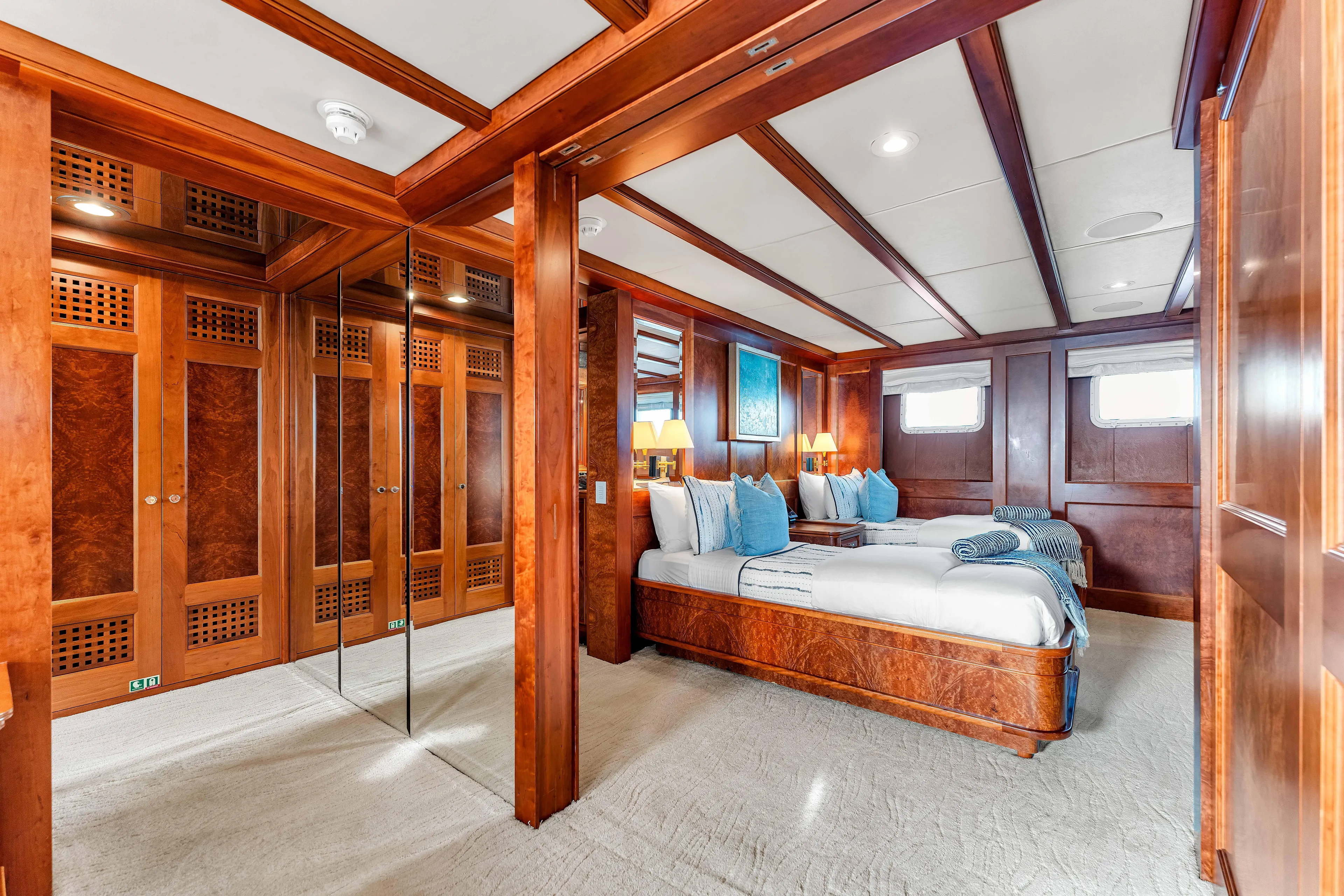 Star Diamond Yacht Photos Pics Luxurious 1998 Admiral Pilothouse yacht bedroom with elegant wood paneling and plush bedding.