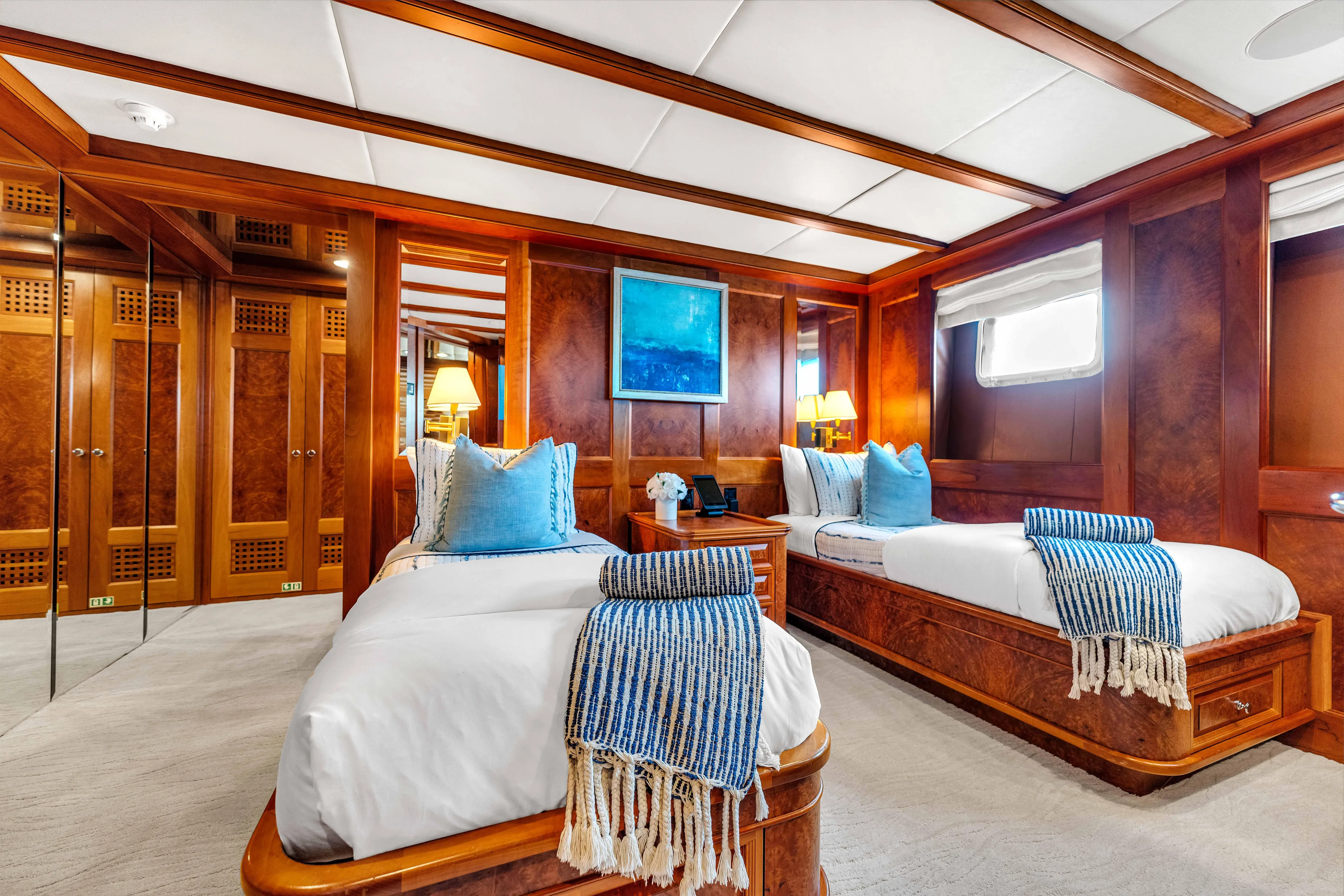 Star Diamond Yacht Photos Pics Luxurious 1998 Admiral Pilothouse yacht bedroom with twin beds, elegant wood paneling, and nautical decor.