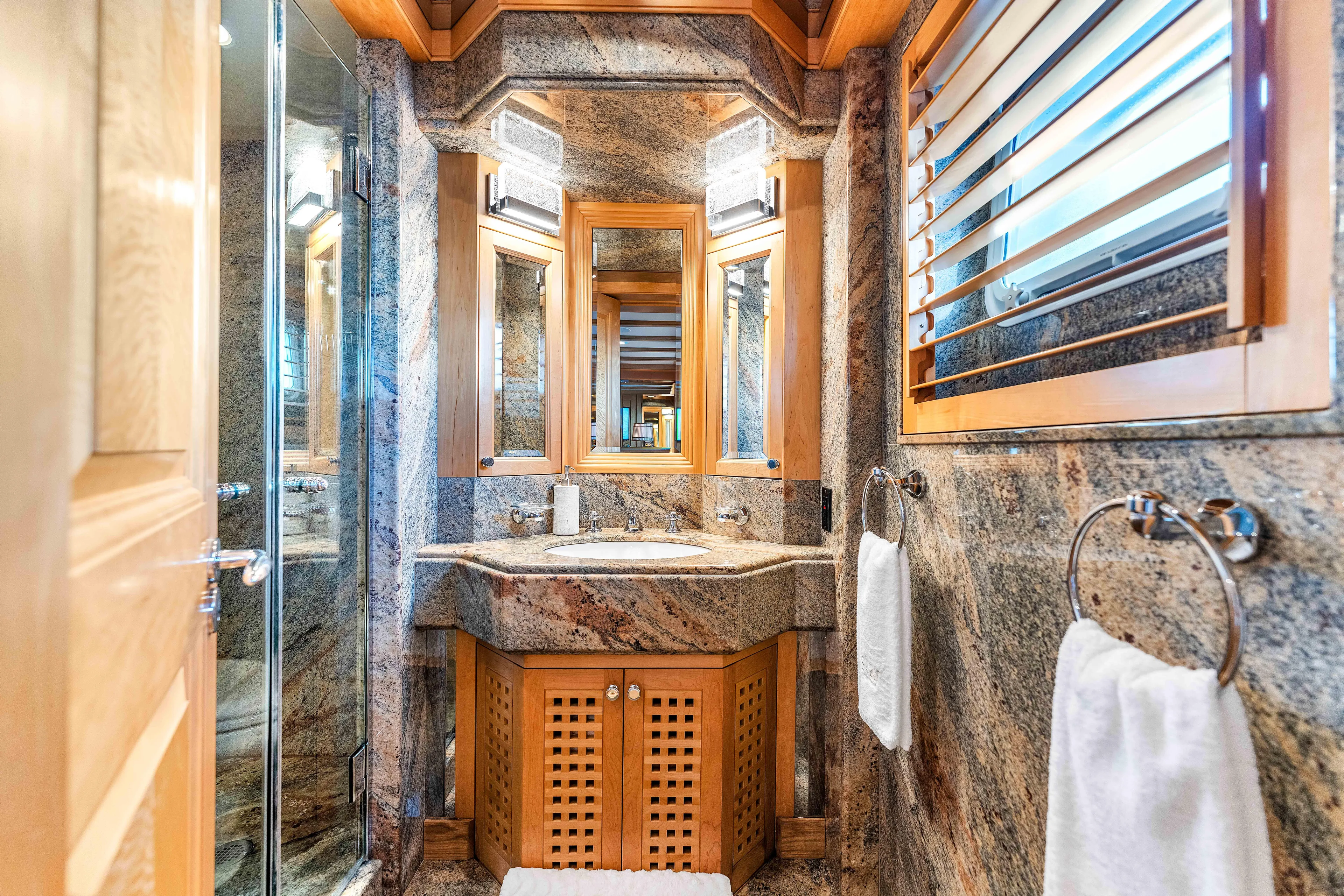 Star Diamond Yacht Photos Pics Luxurious bathroom in 1998 Admiral Pilothouse yacht with marble and wood accents.