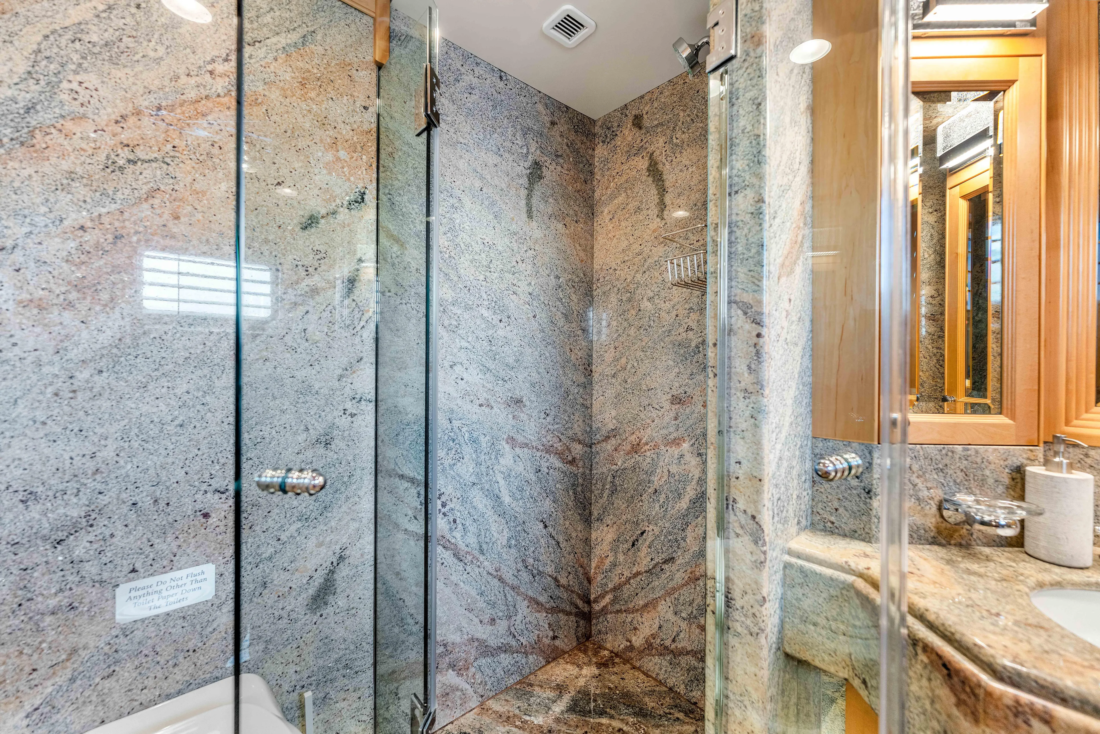 Star Diamond Yacht Photos Pics Luxurious marble bathroom in 1998 Admiral Pilothouse yacht with glass shower enclosure.