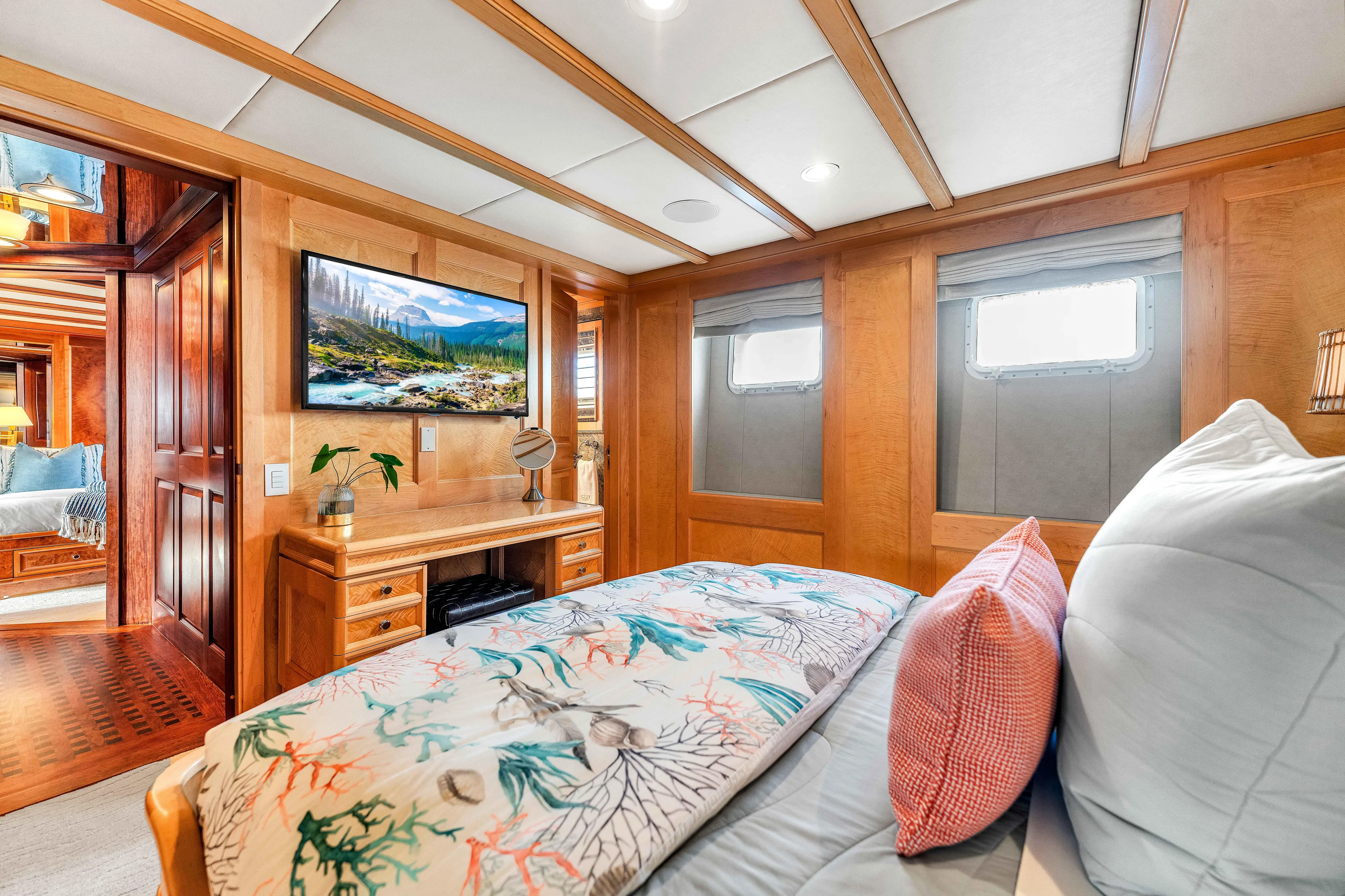 Star Diamond Yacht Photos Pics Luxurious 1998 Admiral Pilothouse yacht bedroom with elegant wood paneling and scenic artwork.