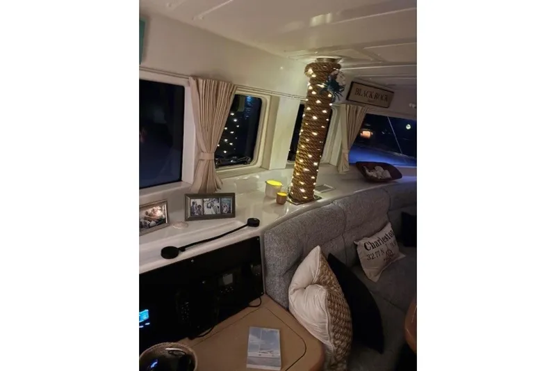 Apres Sea Yacht Photos Pics Interior of 2008 Lagoon 420 yacht with cozy seating and decorative lighting.