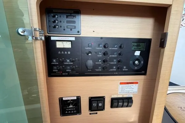 Apres Sea Yacht Photos Pics Control panel of a 2008 Lagoon 420 yacht, featuring various switches and dials.