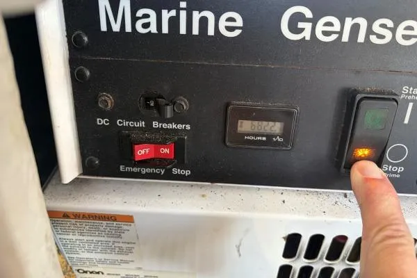 Apres Sea Yacht Photos Pics Control panel of a 2008 Lagoon 420 marine generator with circuit breakers and hour meter.