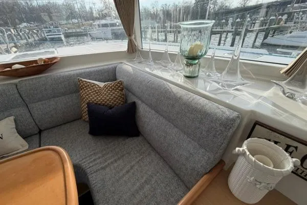 Apres Sea Yacht Photos Pics Cozy interior of 2008 Lagoon 420 yacht with gray seating and decorative pillows.