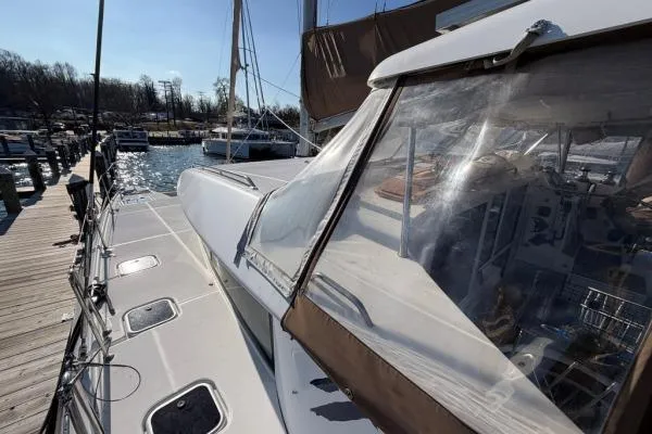 Apres Sea Yacht Photos Pics 2008 Lagoon 420 catamaran docked, showcasing deck and cockpit area under clear skies.