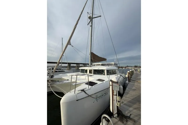 Apres Sea Yacht Photos Pics 2008 Lagoon 420 catamaran docked at marina under cloudy sky.