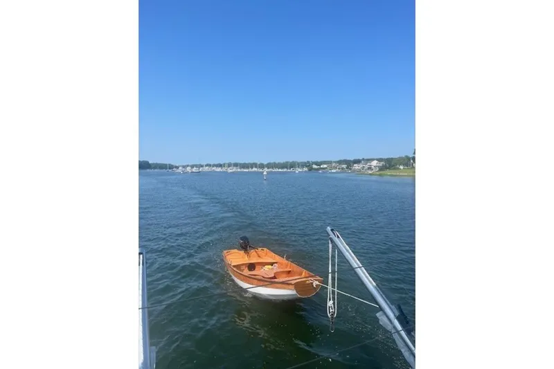 Apres Sea Yacht Photos Pics Sailboat on calm water, view from Lagoon 420, 2008 model, under clear blue sky.