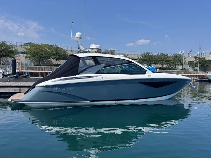  Yacht Photos Pics 2018 Cobalt A36 boat docked in a marina under a clear blue sky.