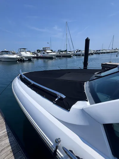  Yacht Photos Pics 2018 Cobalt A36 boat docked at marina with other vessels in background.