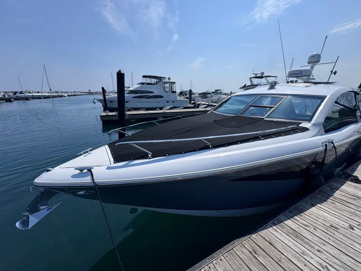  Yacht Photos Pics 2018 Cobalt A36 yacht docked at marina under clear blue sky.