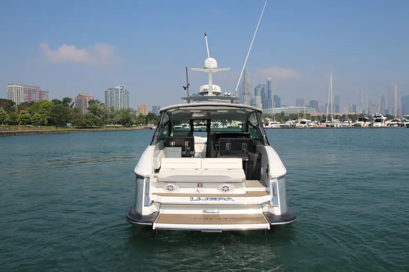  Yacht Photos Pics 2018 Cobalt A36 boat on water with city skyline in background.